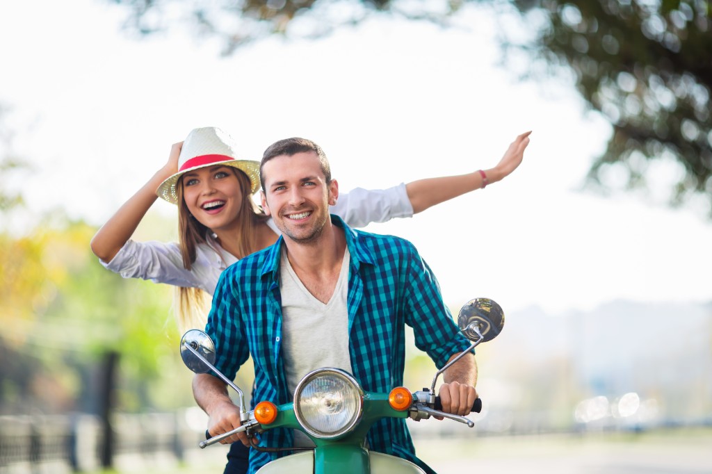 Couple enjoying a scooter ride in Chania